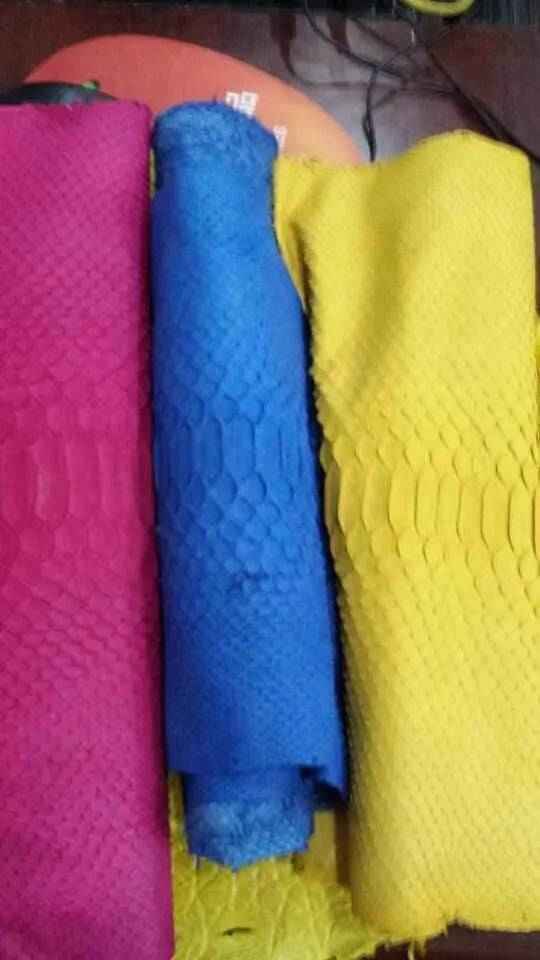 Exotic Python Skin leather accessory in vibrant colorway, showcasing textured snake pattern from Rossieviren.