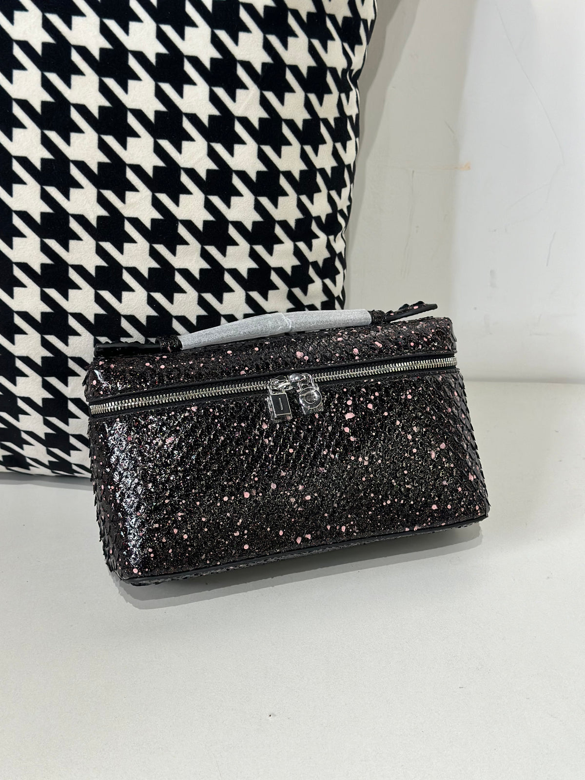 Genuine python skin leather zipper handbag with handle by Rossie Viren, showcasing luxurious textured python leather and sleek design.